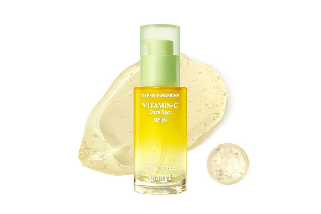 A bottles with yellow serum inside and a light green cap.