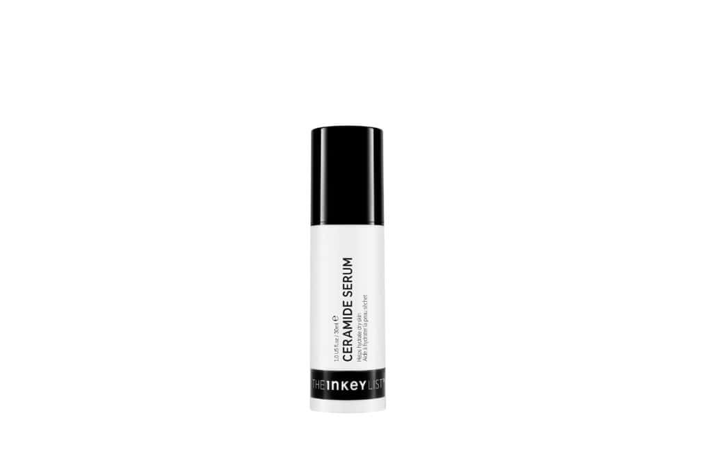 A white and black bottle of ceramide serum for dry skin