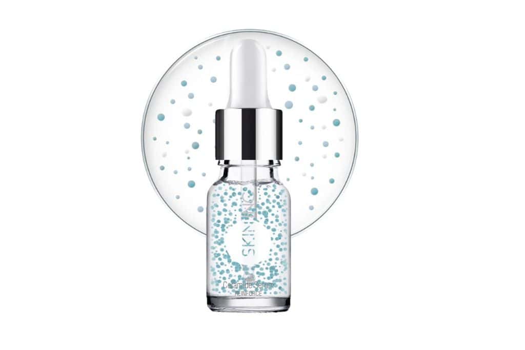 A clear blue bottle of ceramide serum for dry skin.
